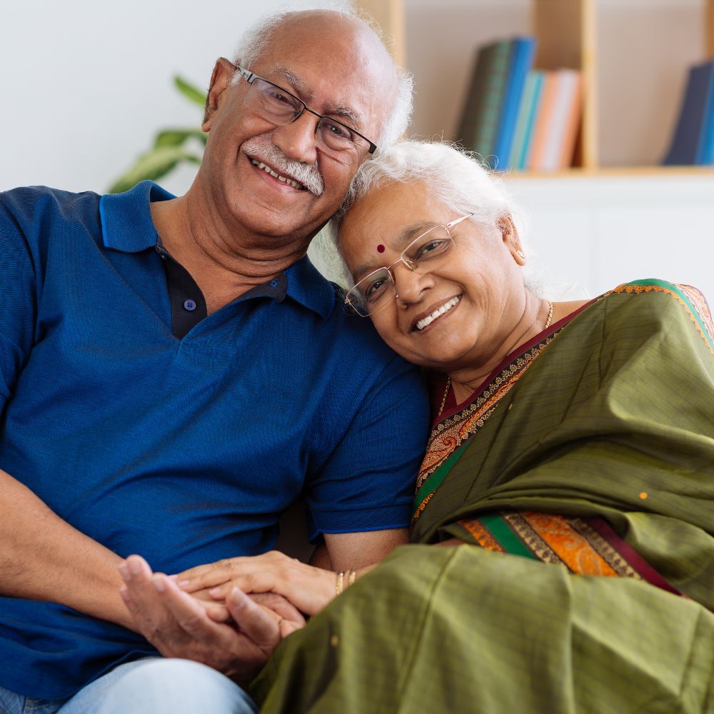 Older Indian couple at home, warm daylight