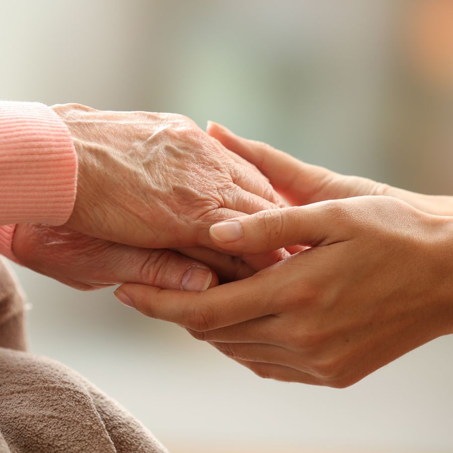 Close-up: senior hands holding a tablet strip