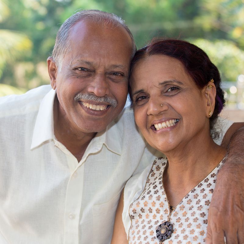 Elderly couple walking in a park